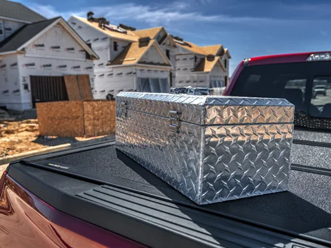 A tool box on a pickup at a building site